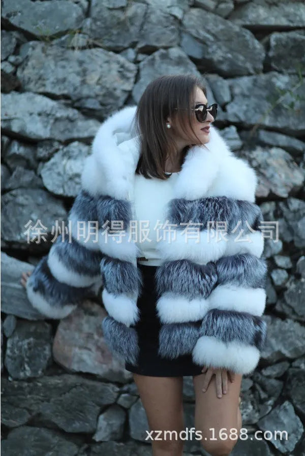 Women's loose artificial fur hooded coat in brown on a model, showing street fashion style.