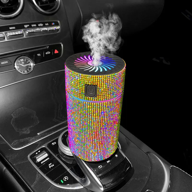 Compact white car air purifier humidifier with USB cord on car dashboard