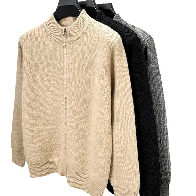 Men's black knitted zip-up cardigan with a stand collar, shown in a loose fit.