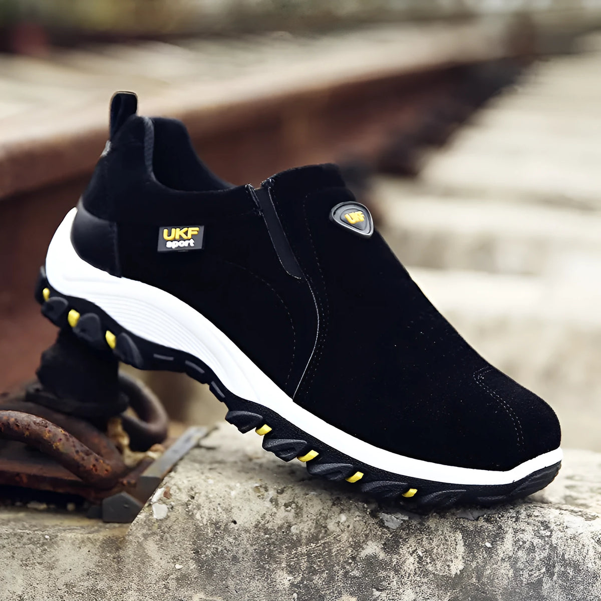 Men's non-slip hiking shoes with artificial PU upper and thick plastic sole on outdoor trail