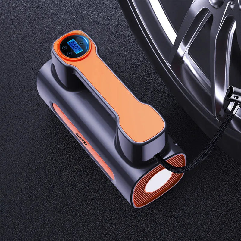 Black portable car tyre inflator with digital LCD screen and USB charging cable on a grey background
