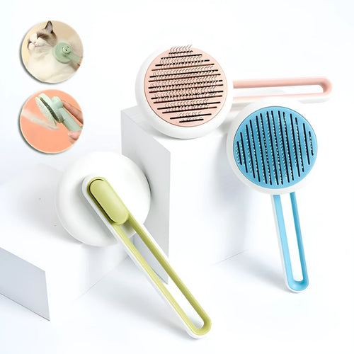 Automatic pet grooming brush with stainless steel pins in blue, green, or pink, showing the handle grip and release button.