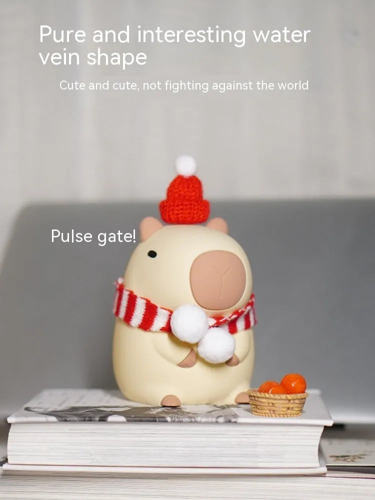 Capybara-shaped silicone night lamp with USB charging port and compact dimensions