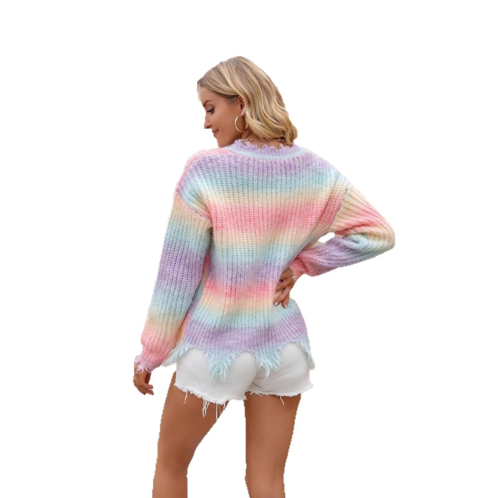 Pink rainbow gradient loose knitted sweater with tassel detail on mannequin