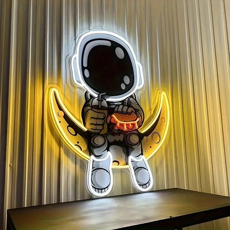 Blue and yellow astronaut-shaped neon light sign mounted on a wall