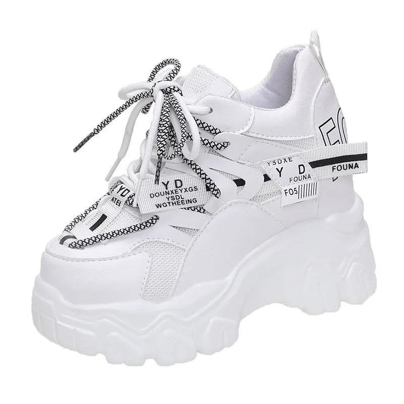 White women's low-top mesh platform sports shoes with a cross strap and rubber sole.