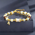 Retro bamboo design bracelet with Ruyi symbol and floral glass beads in electroplated finish