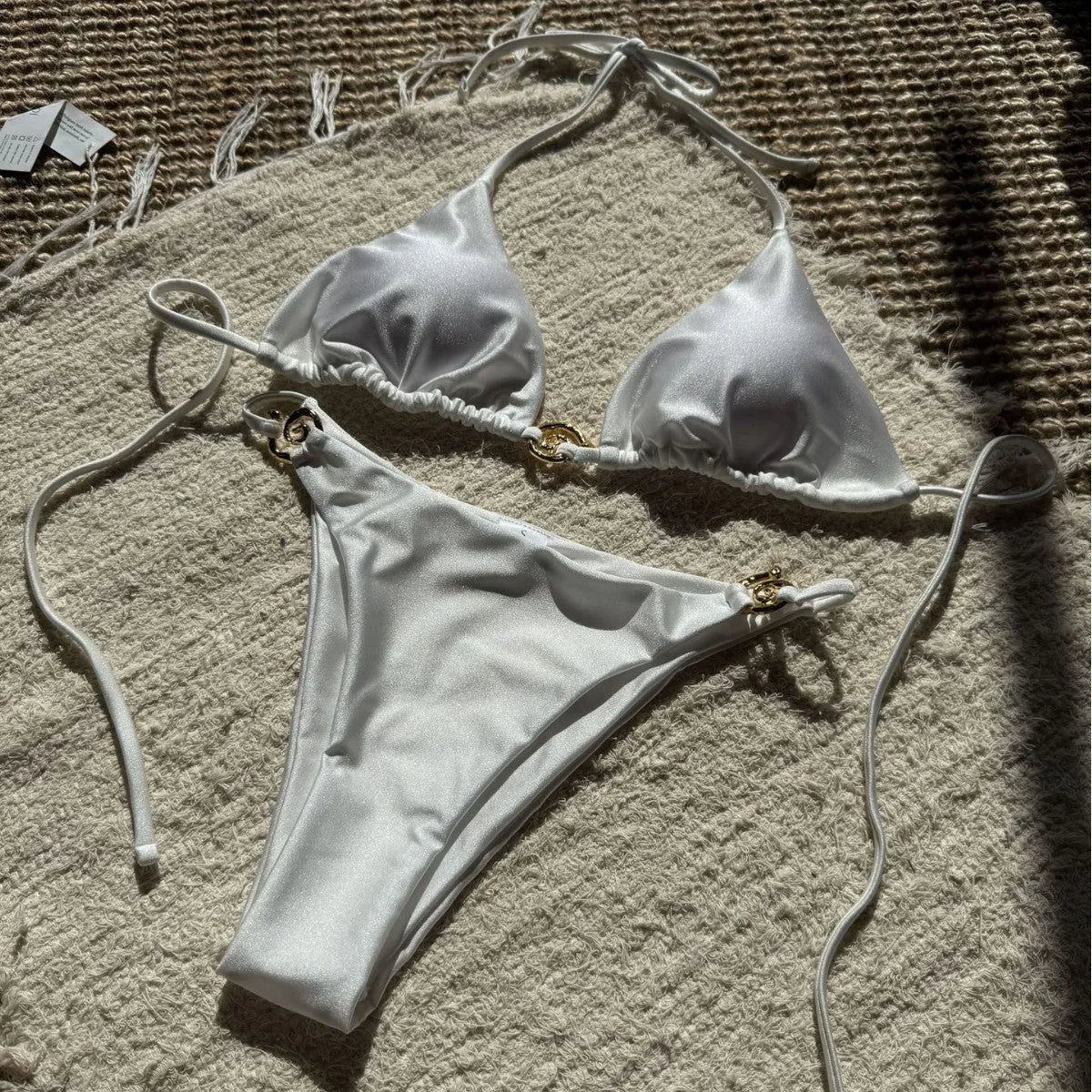 Nylon metal ring lace-up backless bikini two-piece swimsuit in white with metal accents