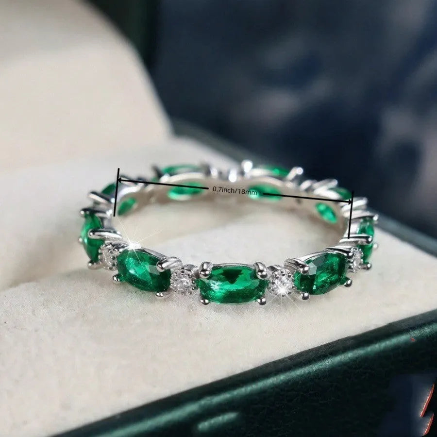 Copper ring with green and white zircon inlay geometric design on finger