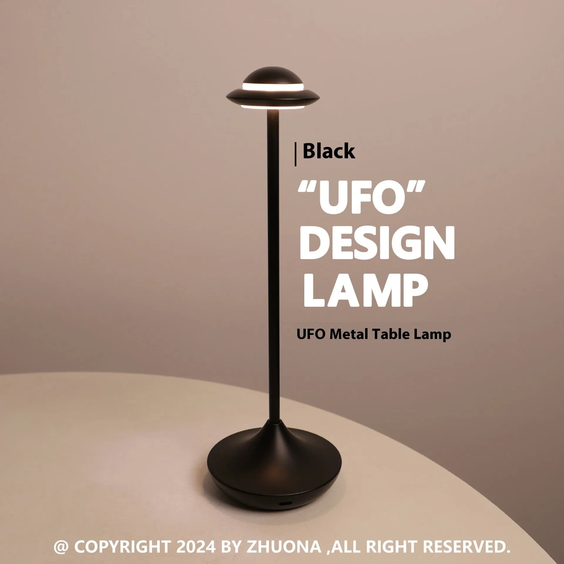 Modern UFO-shaped metal table lamp in black on a wooden desk, showcasing its rechargeable, touch-dimming design.