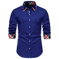 Men's blue plaid long sleeve shirt with a white triangle contrast collar laid flat.
