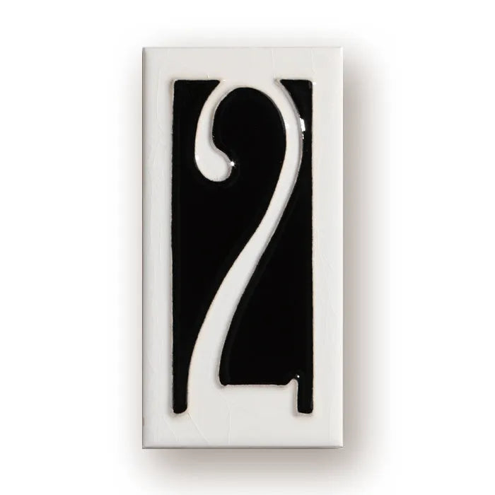 Handmade retro-style ceramic doorplate with an enamel art number on a white background.