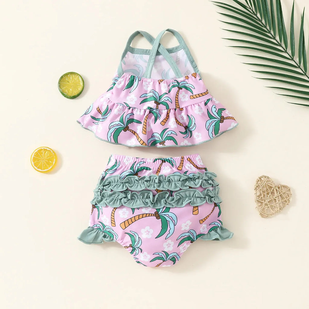Toddler girl's white two-piece swimsuit set with shirt top and matching shorts