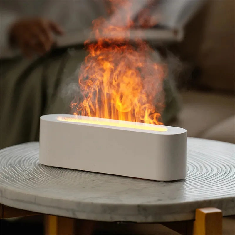 White square plastic flame aroma diffuser humidifier with LED lights and water vapour mist.