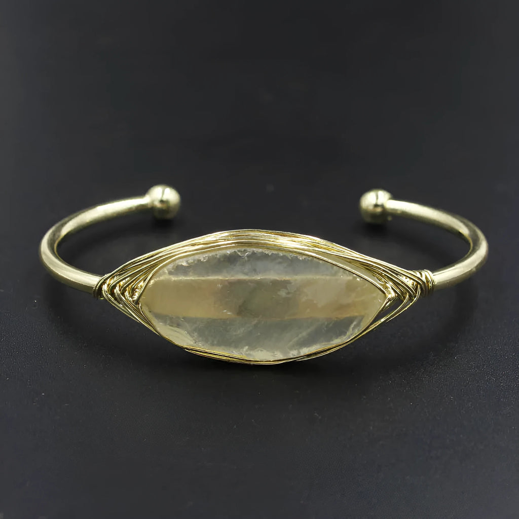 Natural raw gemstone bracelet with 8mm amorphous crystal beads on a white background.