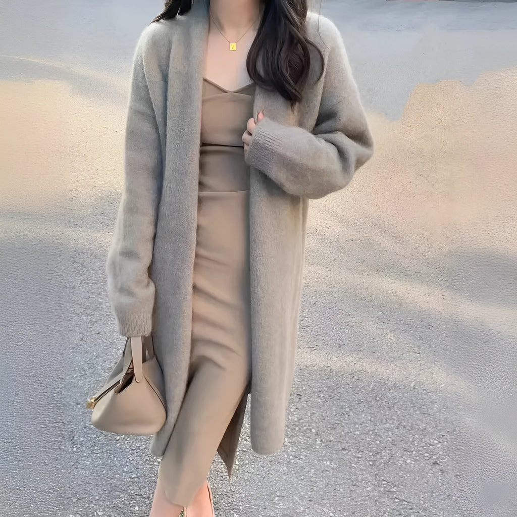 Women's loose fit V-neck knitted cardigan in a mid-length style, shown in a choice of colours.