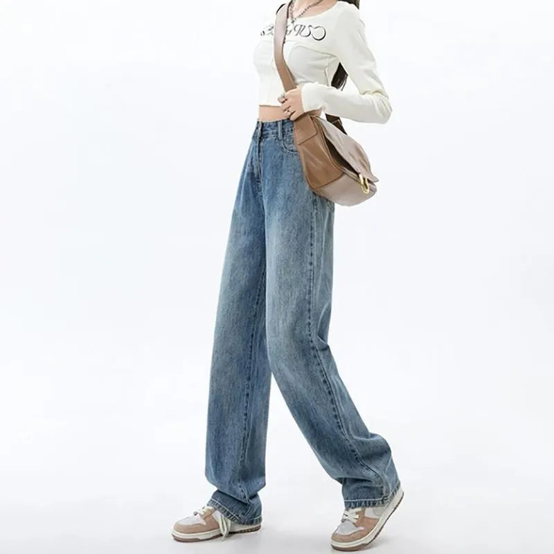 Women's retro blue high-waist wide-leg denim jeans on a hanger, showing the straight leg cut and front pockets.
