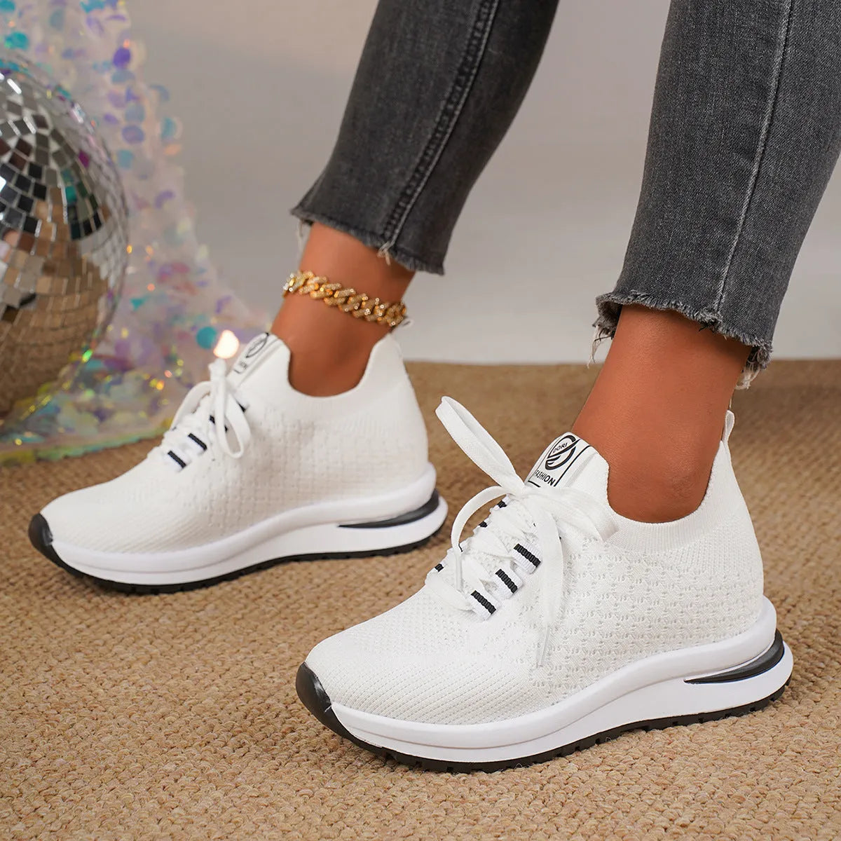Women's black and white mesh platform sneakers with flat sole and lace-up front.