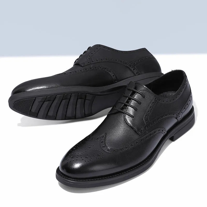 Men's black brogue formal shoes with a lace-up front and perforated detail.