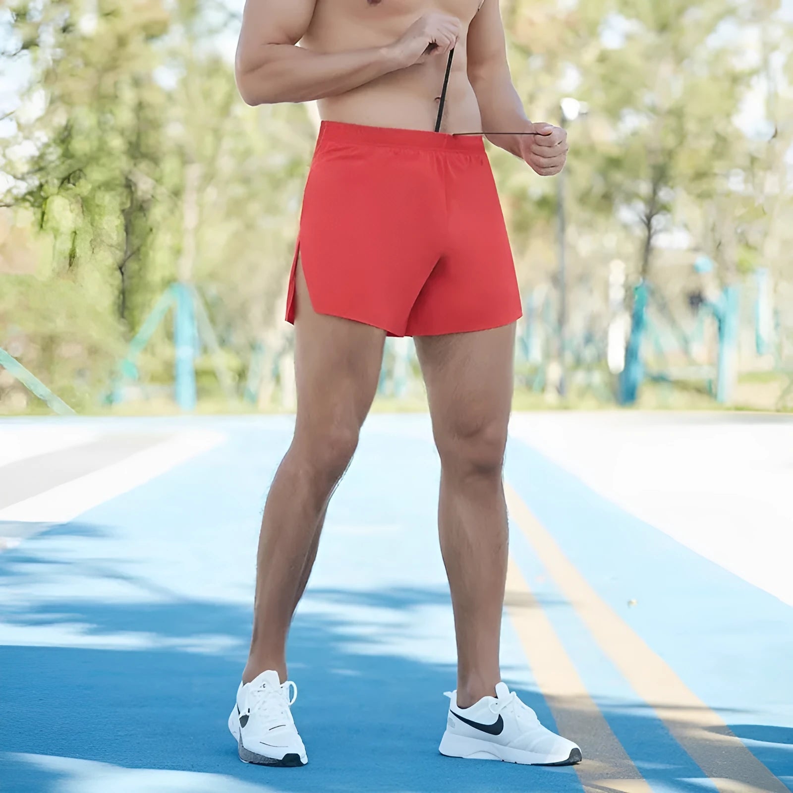 Men's loose-fit off-road running shorts in grey, showing high-waist design and built-in lining.