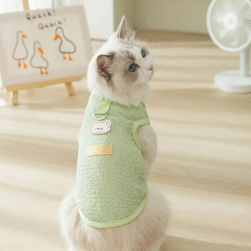 Cat wearing hollowed-out breathable clothes with bear patch in knitted fabric