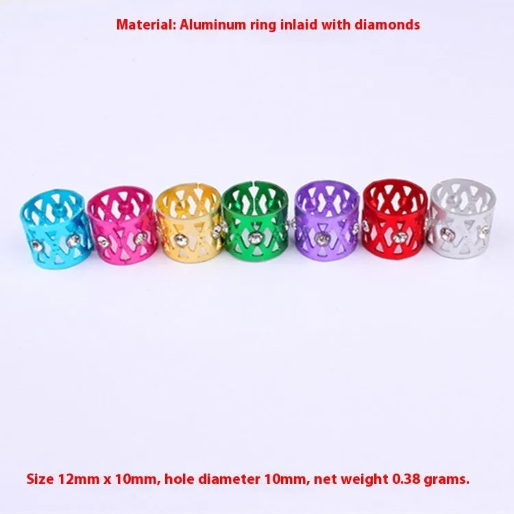 Aluminium hair ring wig decoration with hollow jewelled design and crown motif in multiple colour options.