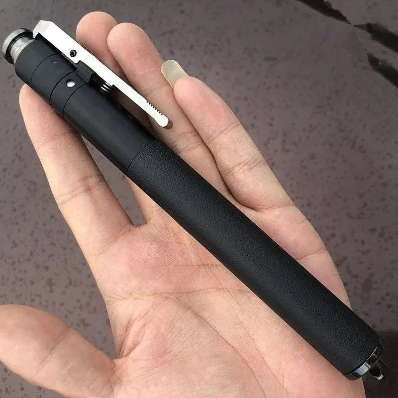 Titanium black aluminium alloy automatic spring expandable baton in collapsed and extended states.