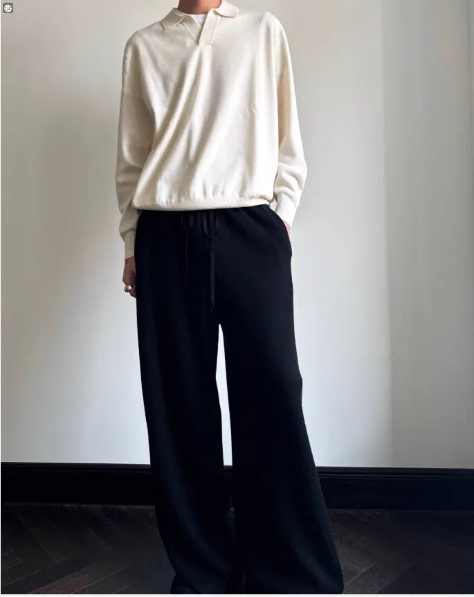 Man's pure wool polo sweater with lapel collar in loose fit, shown in milky white.