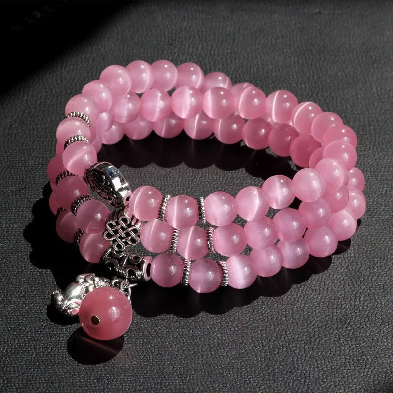 Opal crystal bracelet with geometric cat eye design showing three wraps around wrist