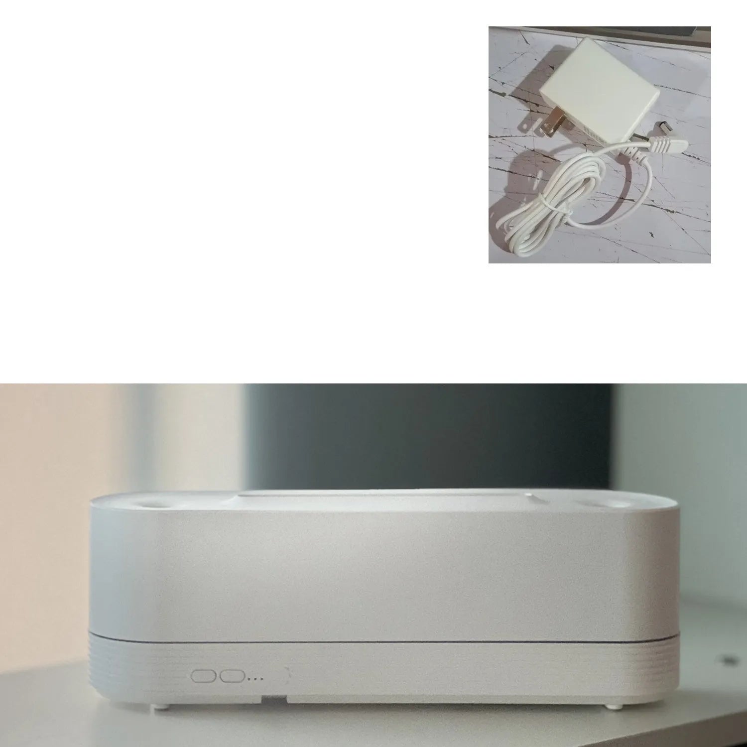 Black or white flame air humidifier with aroma diffuser and 7 colour LED lighting on table