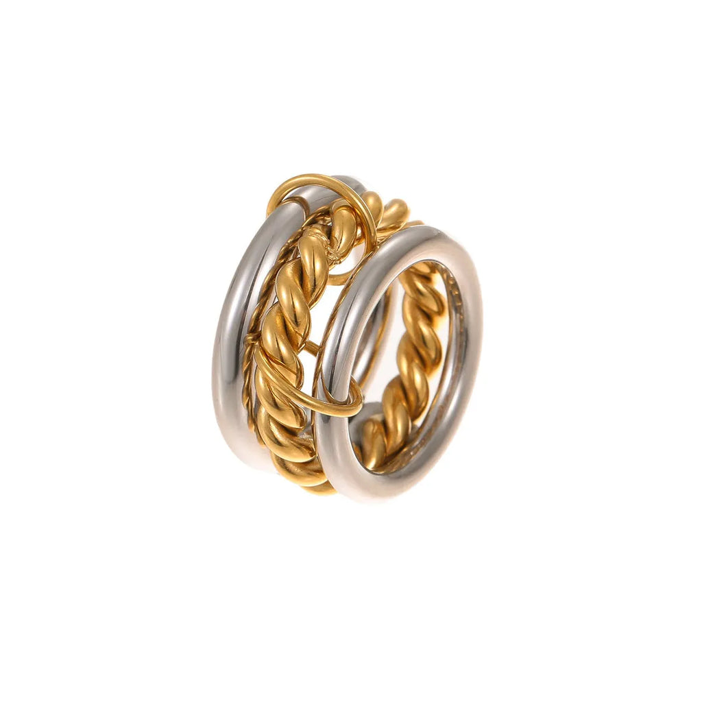 Stacked colour matching stainless steel ring with 18K gold plating on a hand.