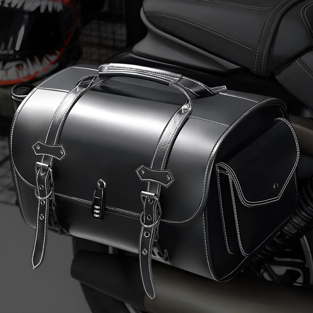 Single dark punk motorcycle side bag with a coded lock on a black background.