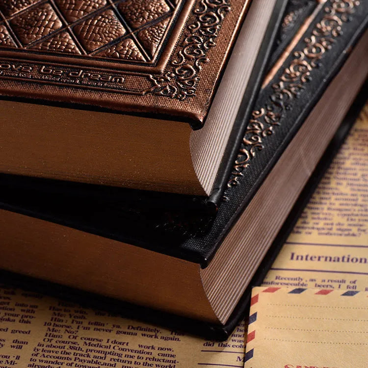 Embossed faux leather notepad in bronze colour with three-dimensional pattern and thick pages