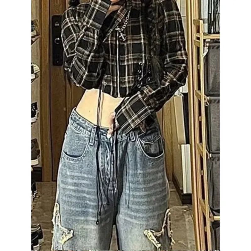 Blue high-waisted women's wide-leg denim jeans with straight-leg cut on a neutral background