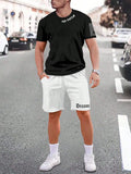 Man wearing a printed short-sleeve top and matching shorts from a sports style suit set.