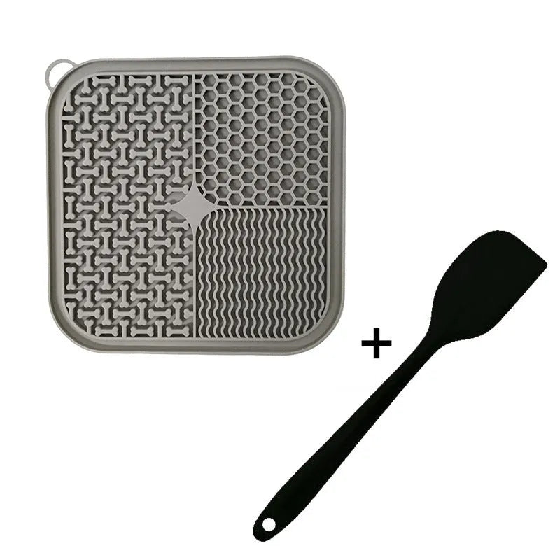 Fengrong silicone slow food bowl in sky blue on a non-slip surface with a scraper alongside