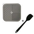 Fengrong silicone slow food bowl in sky blue on a non-slip surface with a scraper alongside