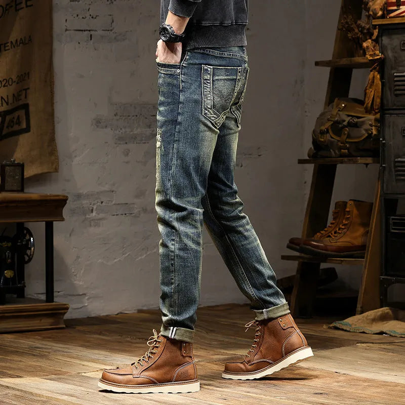 Men's slim-fit retro colour jeans with a zip fly, laid flat to show the skinny pant style.