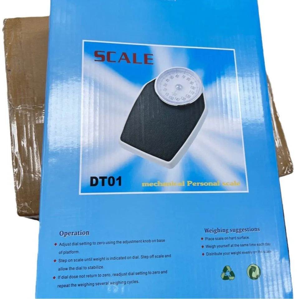 Black mechanical pointer bathroom scale on floor showing large dial and 47x35cm platform.