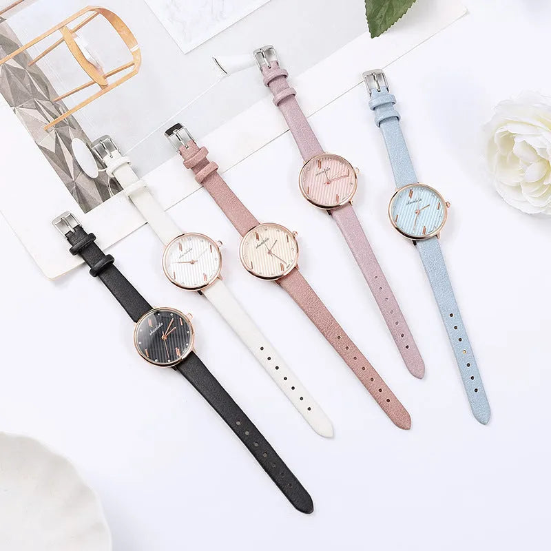 Trendy student watch with round white dial, 32mm diameter, stainless steel buckle on a light background
