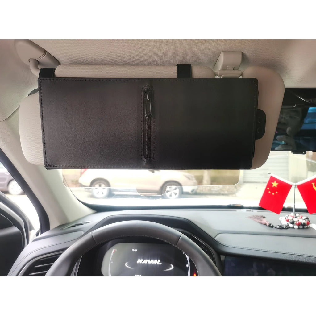 Retractable PU leather car sunshade in black 31x15cm on a vehicle window