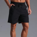 Men's loose straight-leg shorts in quick-drying polyester fabric available in four colours