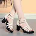 Women's beige hollow-out high heel shoes with rhinestone buckle and fish mouth toe, Korean style.