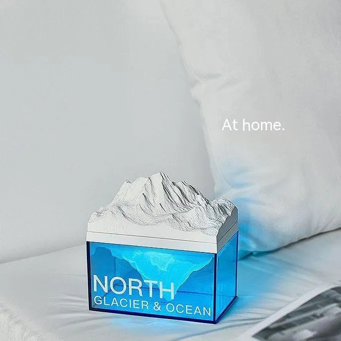 Glacier night light Bluetooth speaker on bedside table with soft ambient glow and compact size 13.8 x 8.5 cm