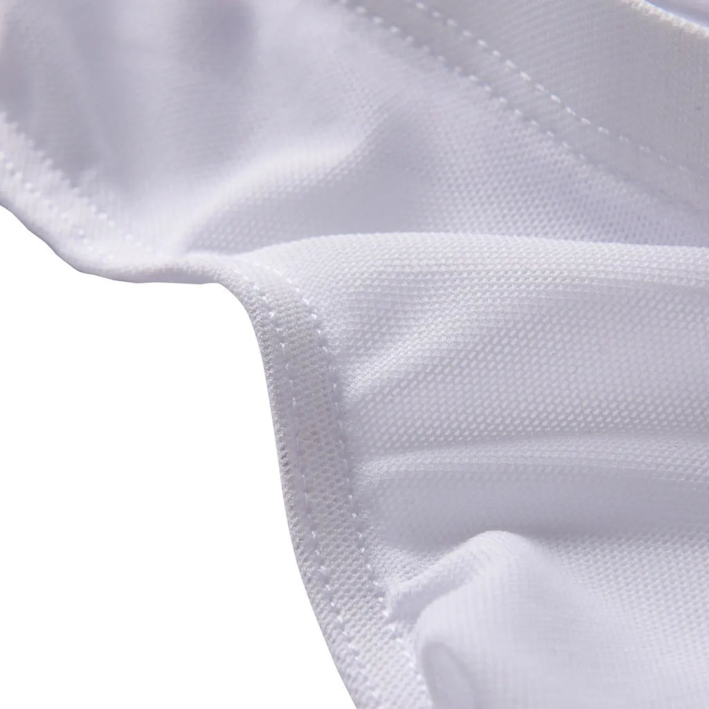 Men's black low-waist triangle briefs made from quick-drying nylon fabric on a grey background.