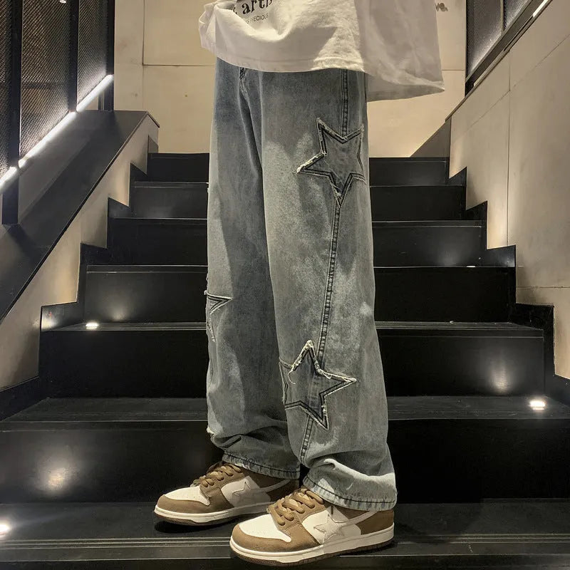 Loose fit cotton denim pants in stone washed light blue with straight leg, front view