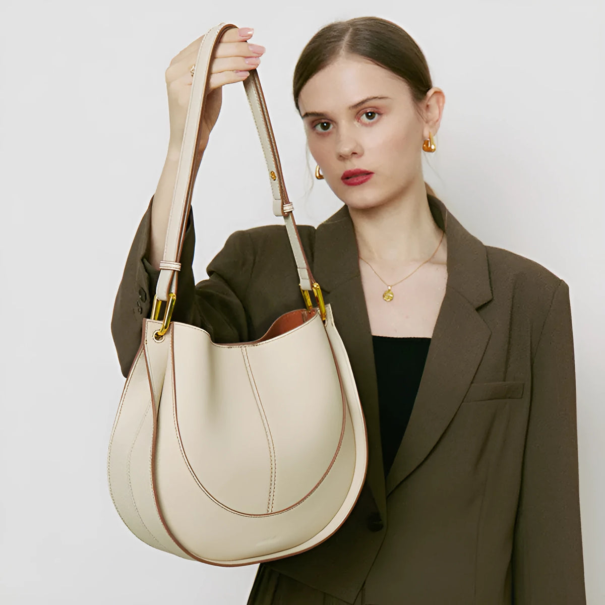 Small round genuine top grain leather crossbody bag for women with splicing design and open outer pocket