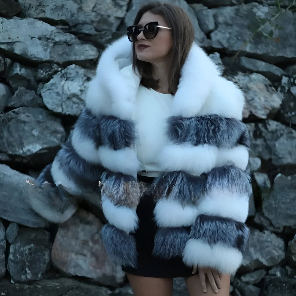 Women's loose artificial fur hooded coat in brown on a model, showing street fashion style.