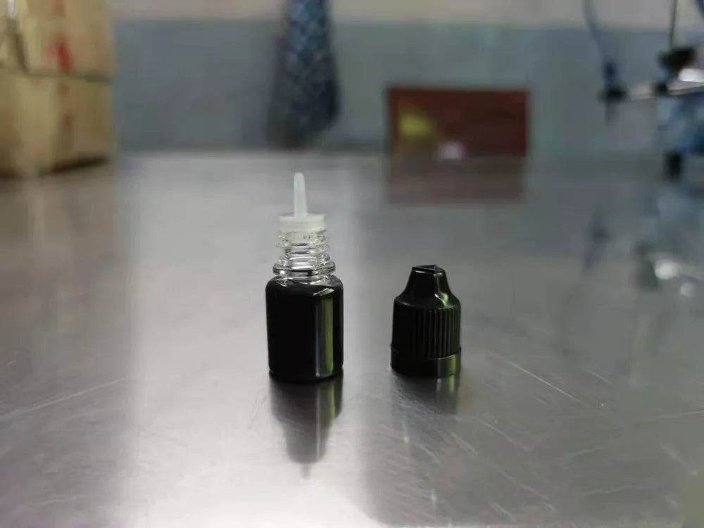 A 5ml bottle of black quick-dry confidentiality seal ink for security stamping.
