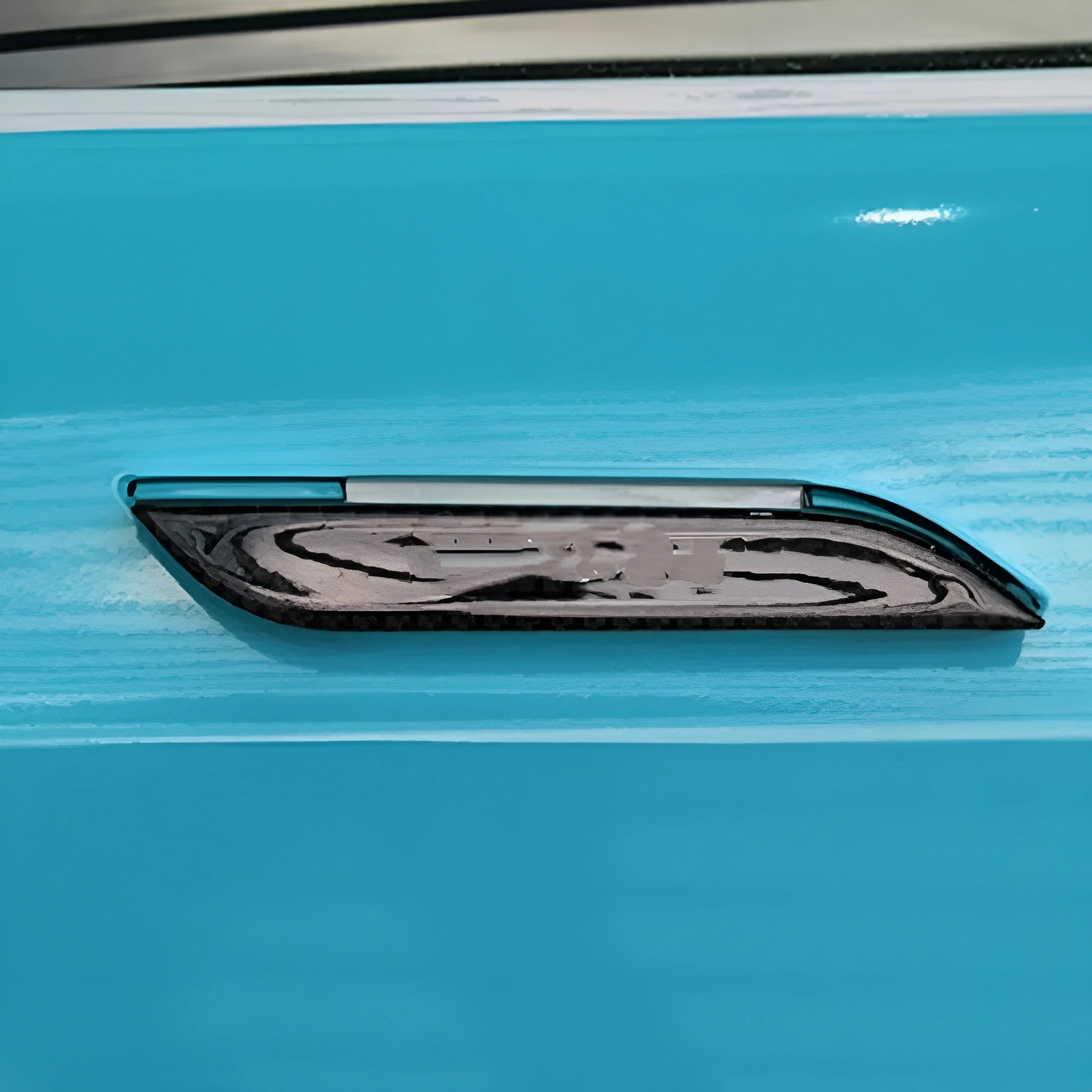 Four black carbon fibre pattern adhesive door handle protectors for a Tesla Model S.